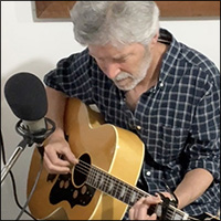 Jonathan Ochshorn playing guitar