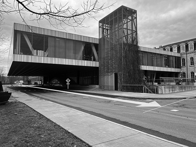 Milstein Hall viewed from University Avenue showing sidewalk.