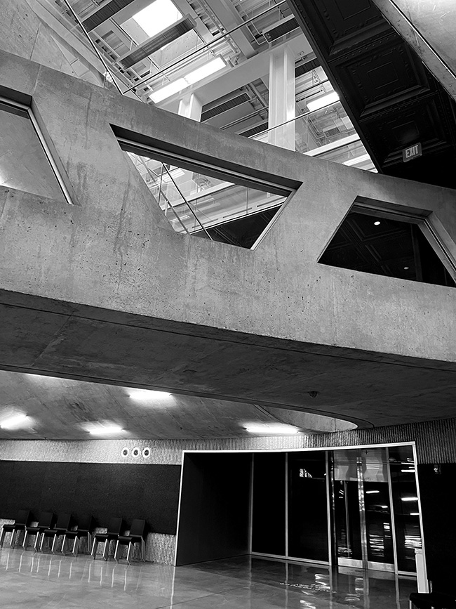 View up from lower-level Crit Room with ground-level bridge and second-floor studios visible.