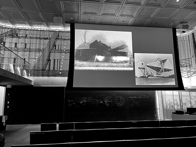 Glare on the projection screen in Milstein Hall's auditorium.