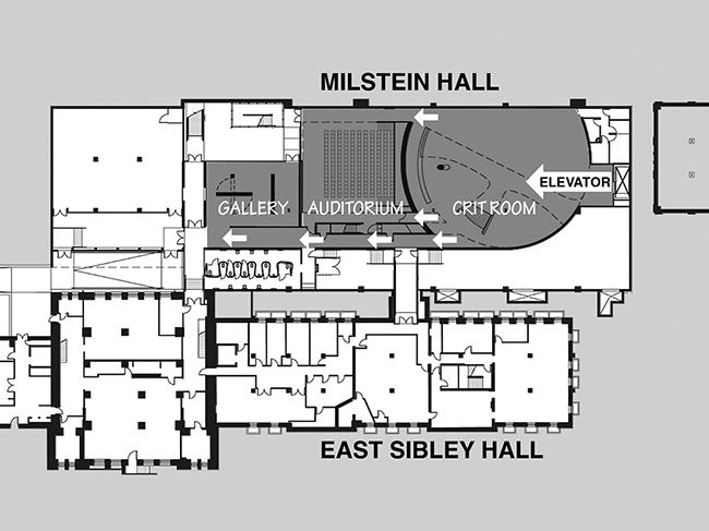 Basement floor plan with arrows indicating circulation patterns from elevator.