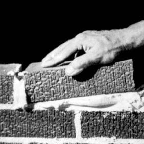 Lifting and positioning brick